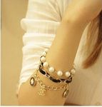 Buy Crunchy Fashion Black Flower Pearl Multilayer Bracelet - Purplle