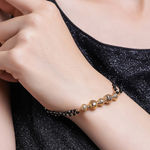 Buy Estele Gold Plated Florat Heart Loop Shaped Black Beads Bracelet with Austrian Crystals for Women - Purplle