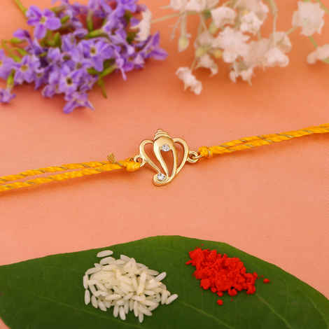 Buy Estele Gold Plated Aadi Dev Rakhi with Austrian Crystals and Fancy Silk Thread - Purplle