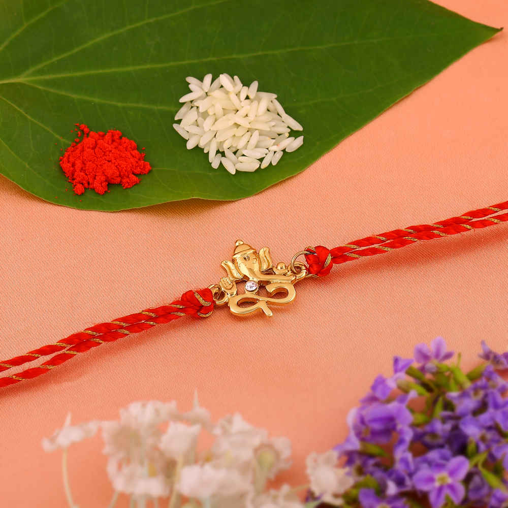 Estele Gold Plated Divine Ganpati Ji Rakhi with Austrian Crystals and ...