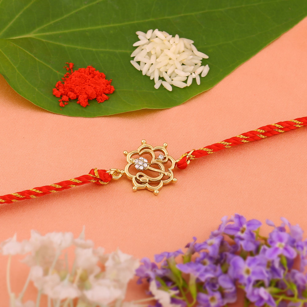 Estele Gold Plated Floral Om Rakhi with Austrian Crystals and Divine ...